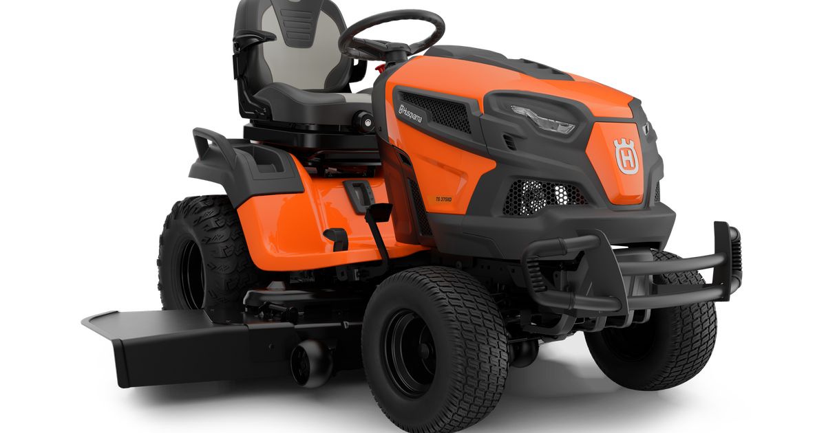 Husqvarna TS 375XD 54 exact-page studio rendering of the orange steering-wheel tractor with mower deck; the image does not visually distinguish deck width.